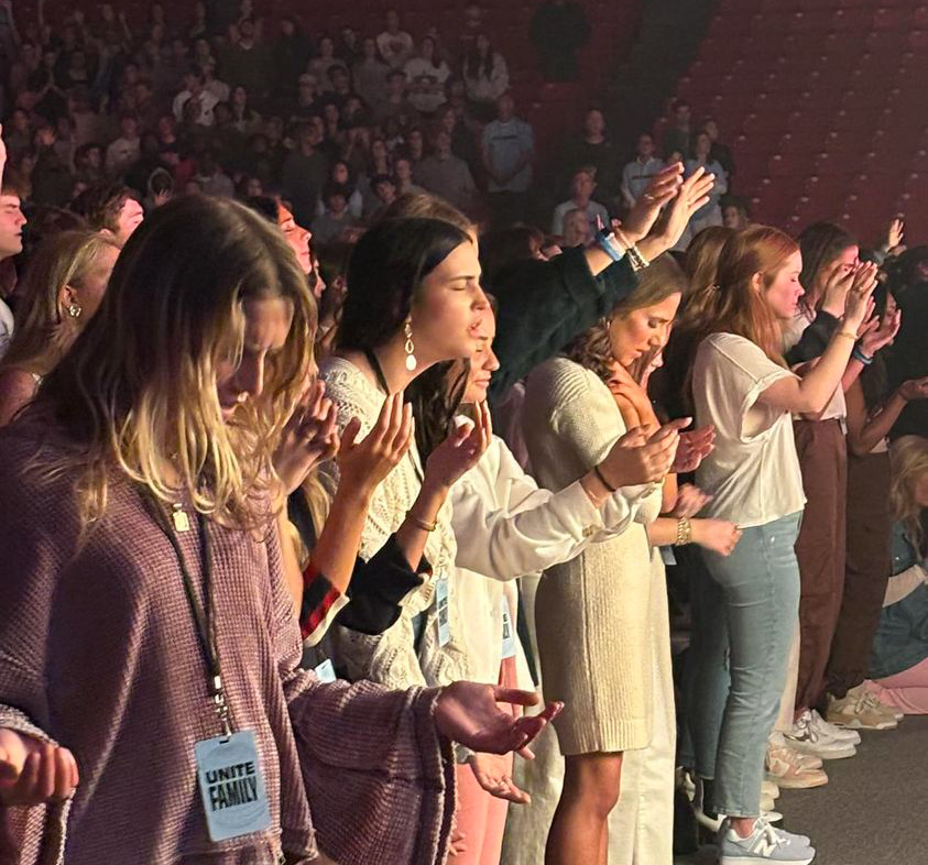 College-aged girls participate in a prayer rally