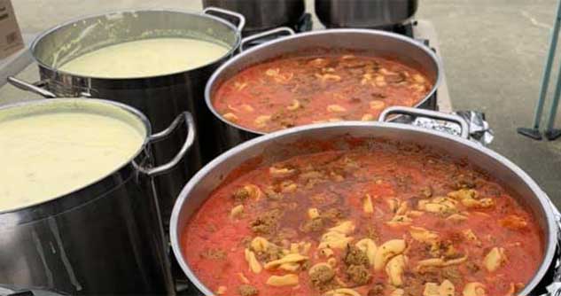 Giant pots of soup simmer