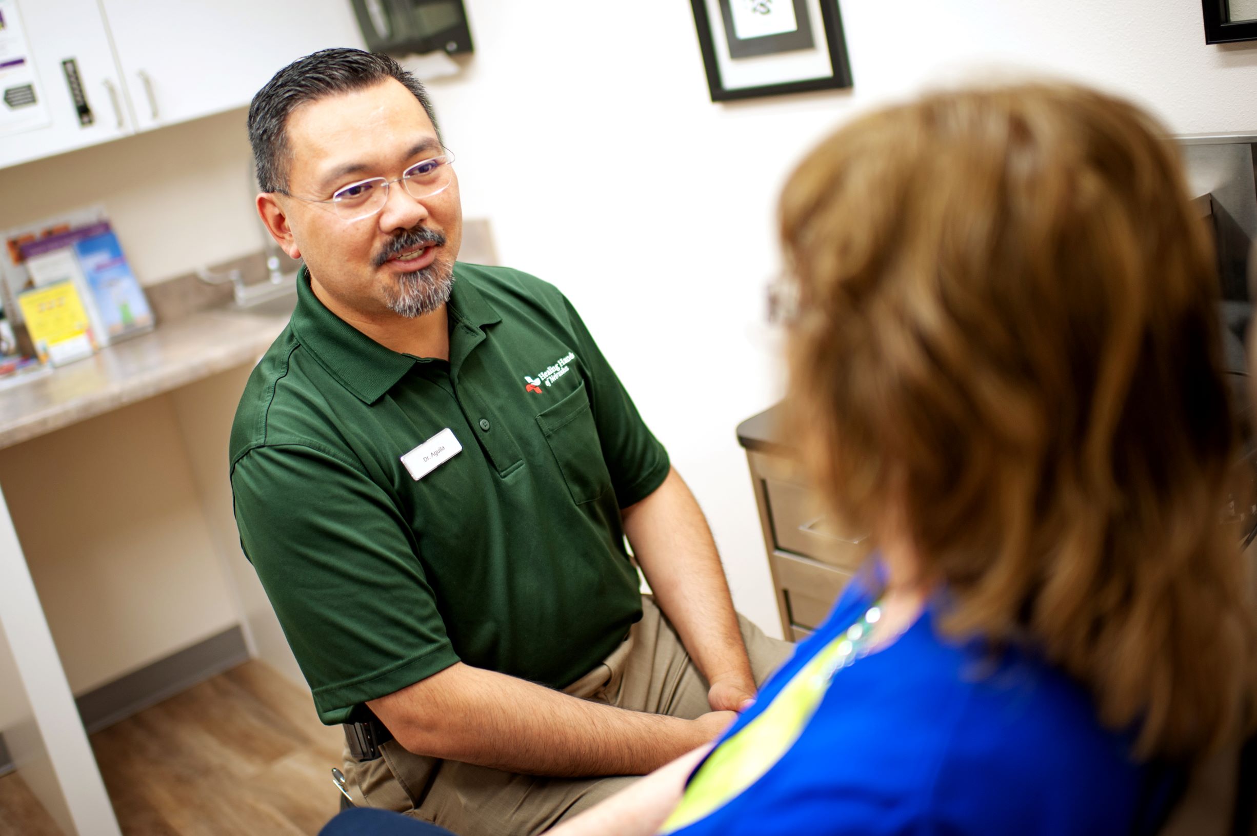 Dr. Demetrio Aguila talking with a patient