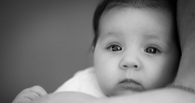 Close up of infant, sad face