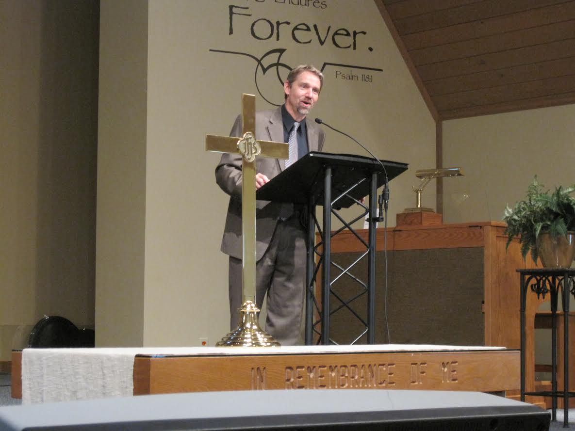 Pastor Steve Johnson Preaching From The Pulpit In Mason City
