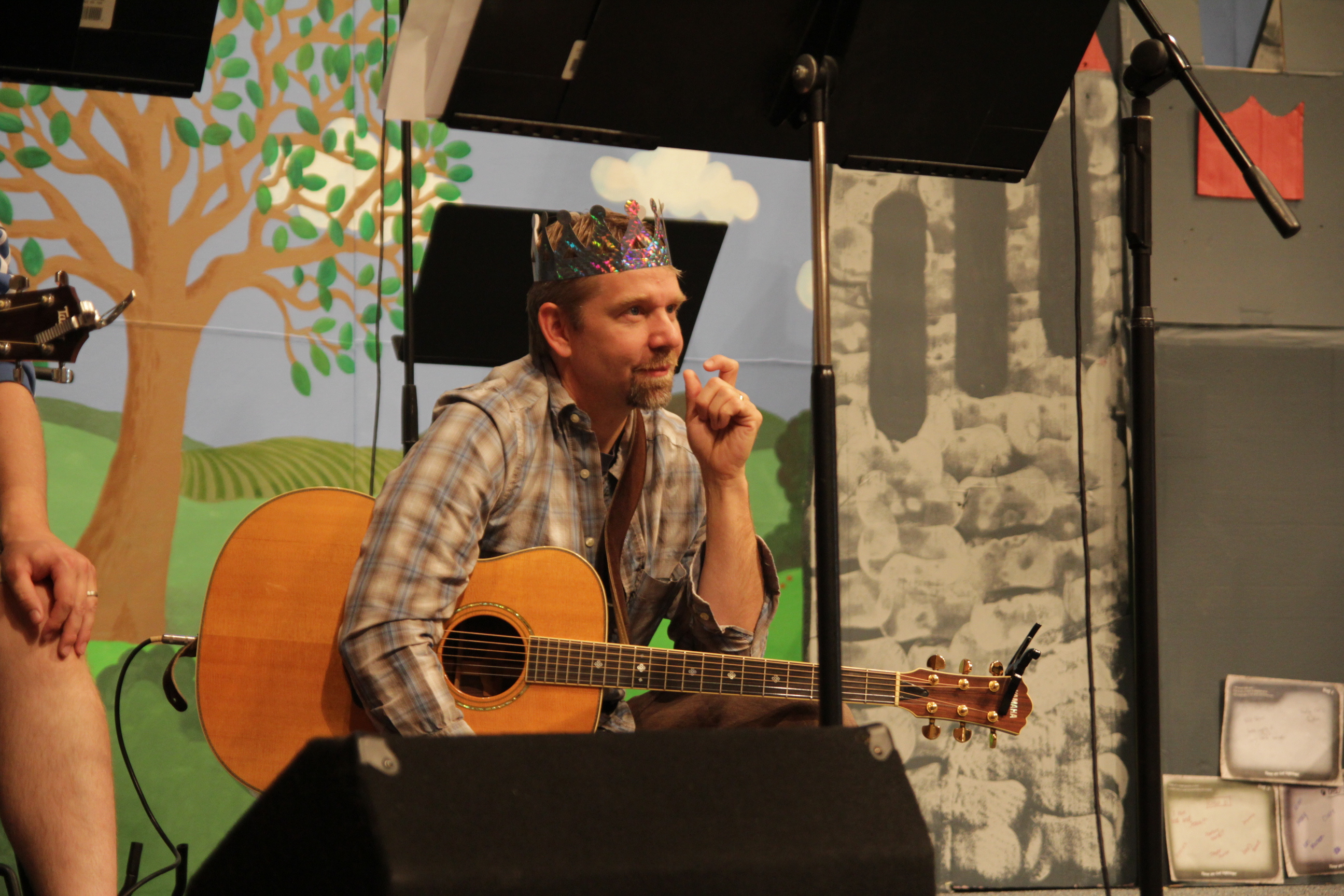 Pastor Steve wearing a costume for Vacation Bible School as he leads worship for the youth