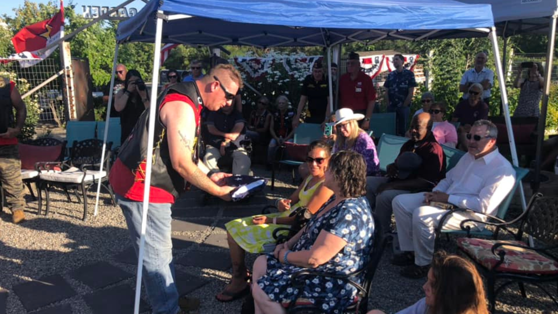 Family members who lost a loved one to military suicide are presented a flag during an Operation Creekside memorial event.