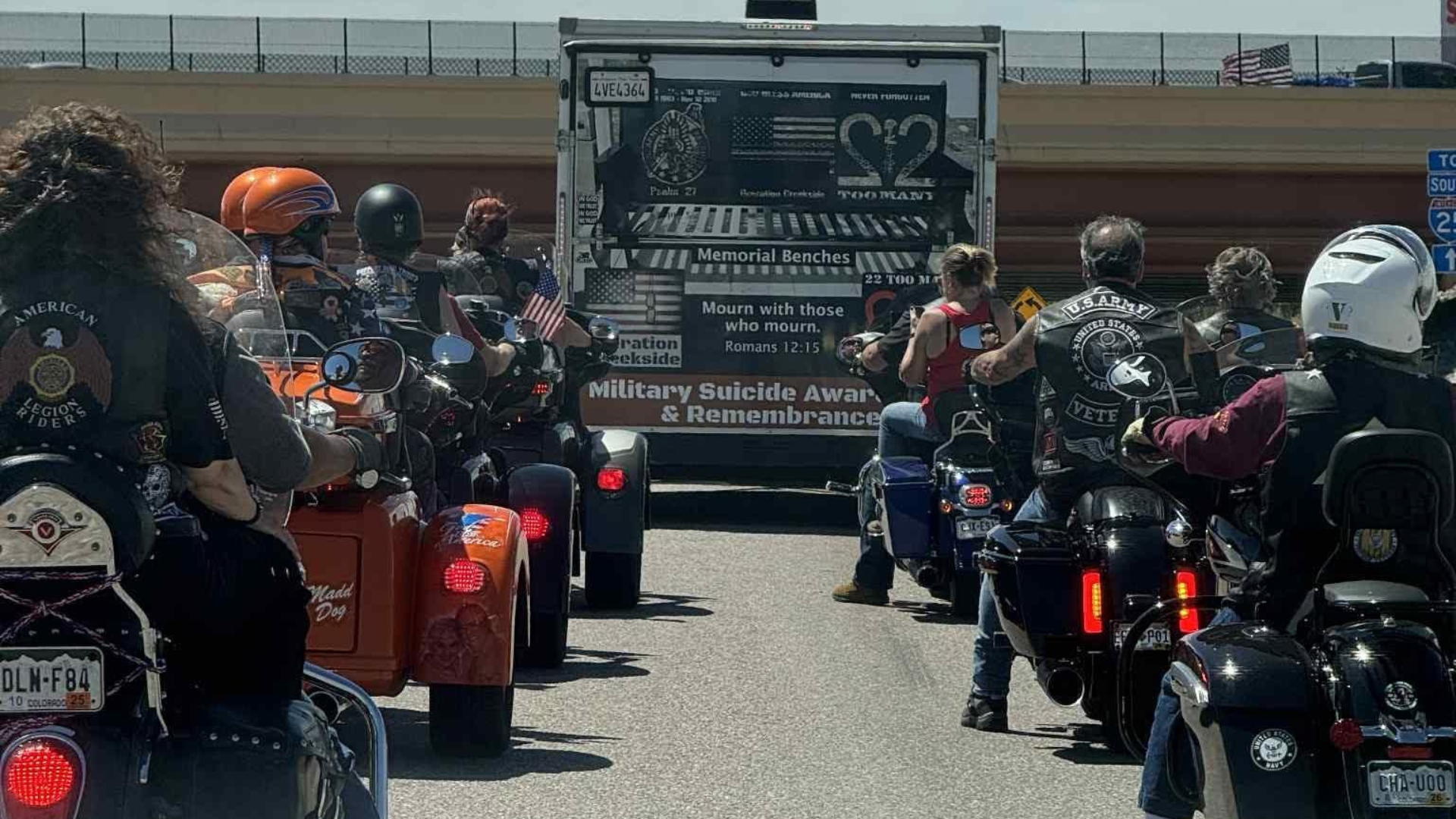 Operation Creekside] A veteran escort leads the Operation Creekside trailer, carrying a memorial bench, to the delivery and presentation to a family affected by military suicide.