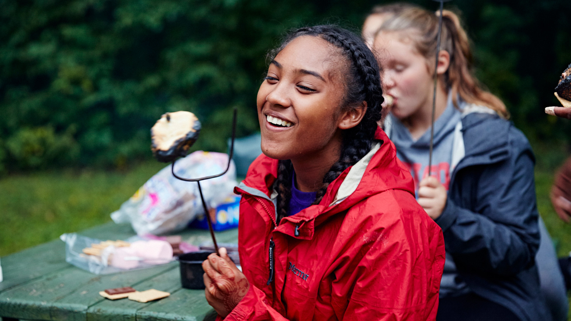 Voyagers enjoy a snack break during a camping trip.