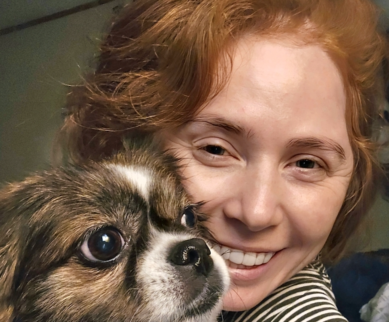 Woman smiling with her dog