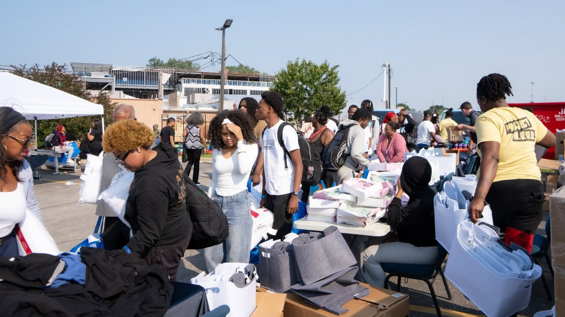 Project HOOD volunteers and residents at a community event.