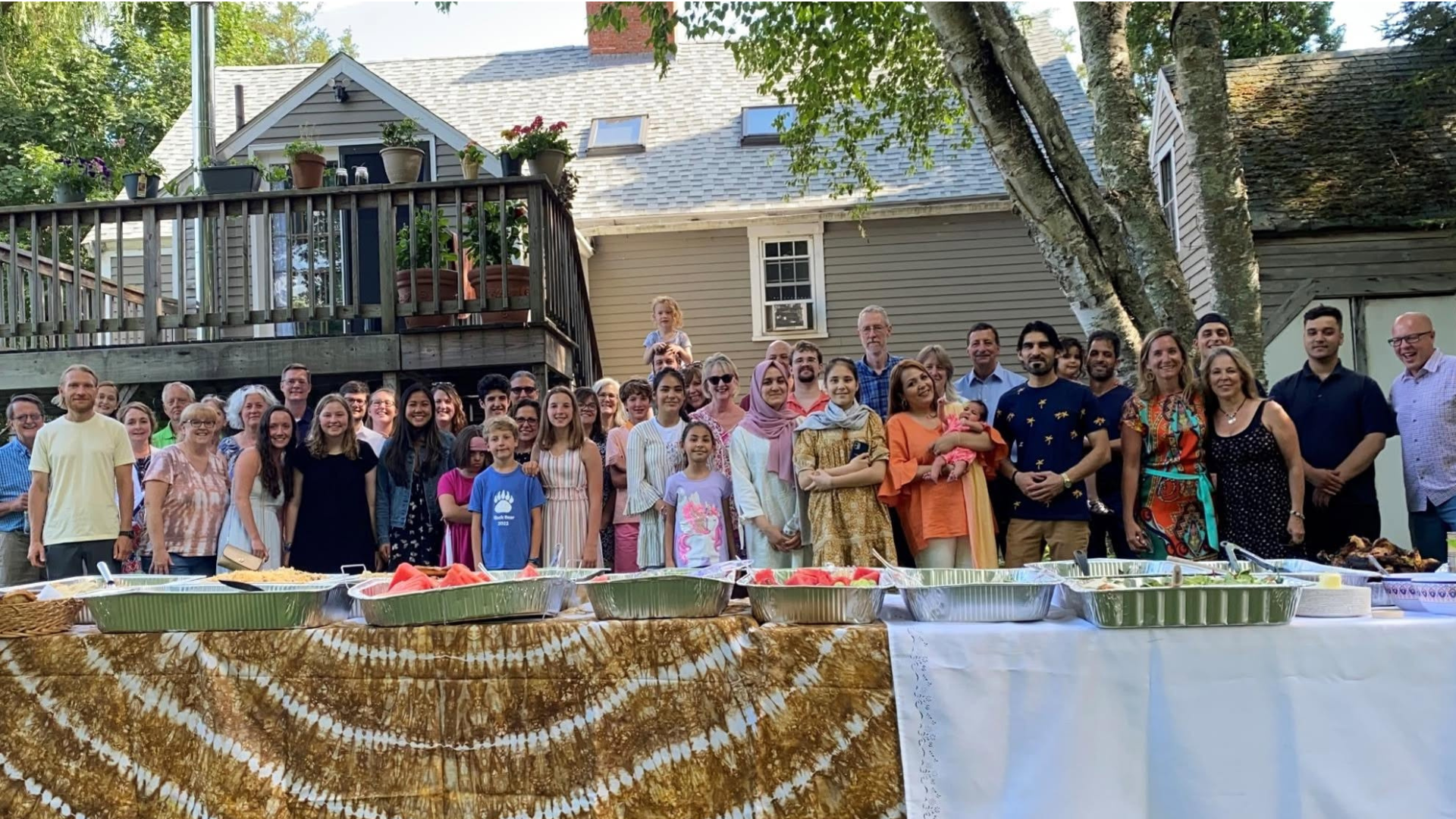 A Neighborhood Support Team and their neighbors celebrate Thanksgiving together.