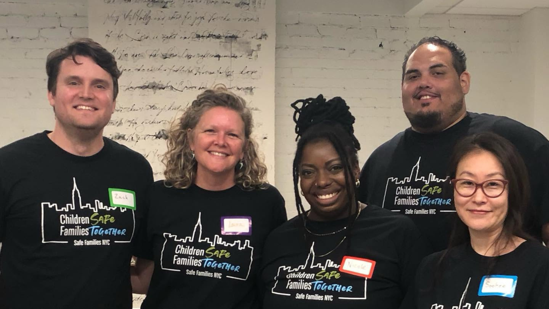 Safe Family NYC volunteers together at an event.