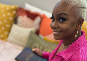 Woman smiling holding a book