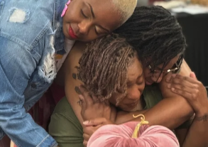 Three women hugging