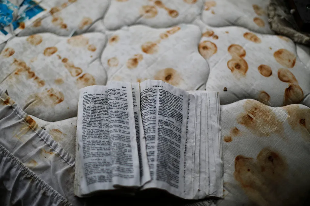  A bible sits on a stained mattress on a pile of debris outside a damaged motel from Hurricane Michael in Panama City, Fla, Jan. 23, 2019