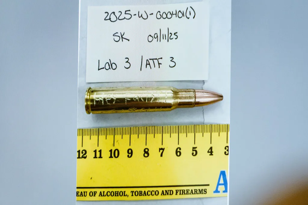 An image of a bullet casing engraved with the words, "Hey Fascist!" is displayed during a preliminary hearing for Tyler Robinson