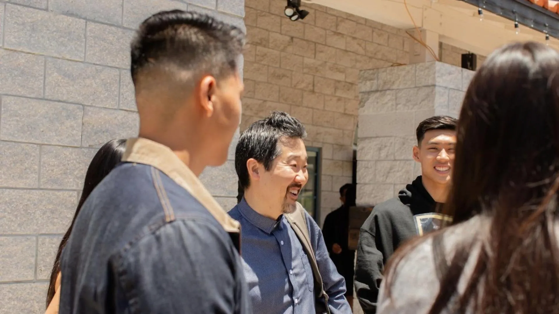Paul Kim speaks with young congregants at Redeemer Encinitas.