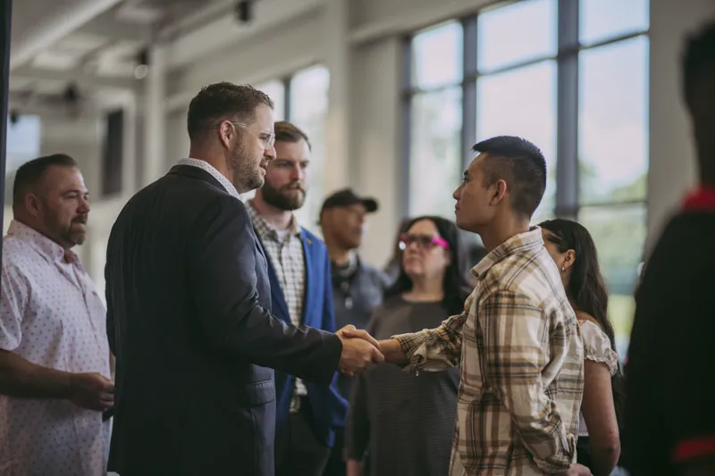 Mike Burnette Shaking Hands After Church