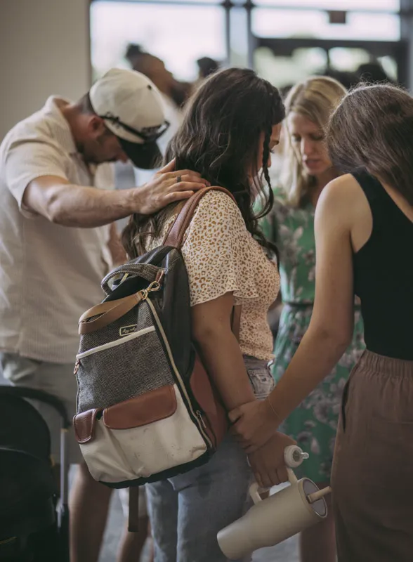 Pastor Stephanie Praying With A Group