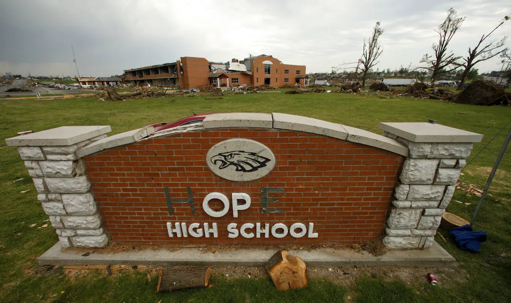 The damaged sign of Joplin High School, pictured here in the days immediately following the tornado that hit the town, became the inspiration for Hope City Church