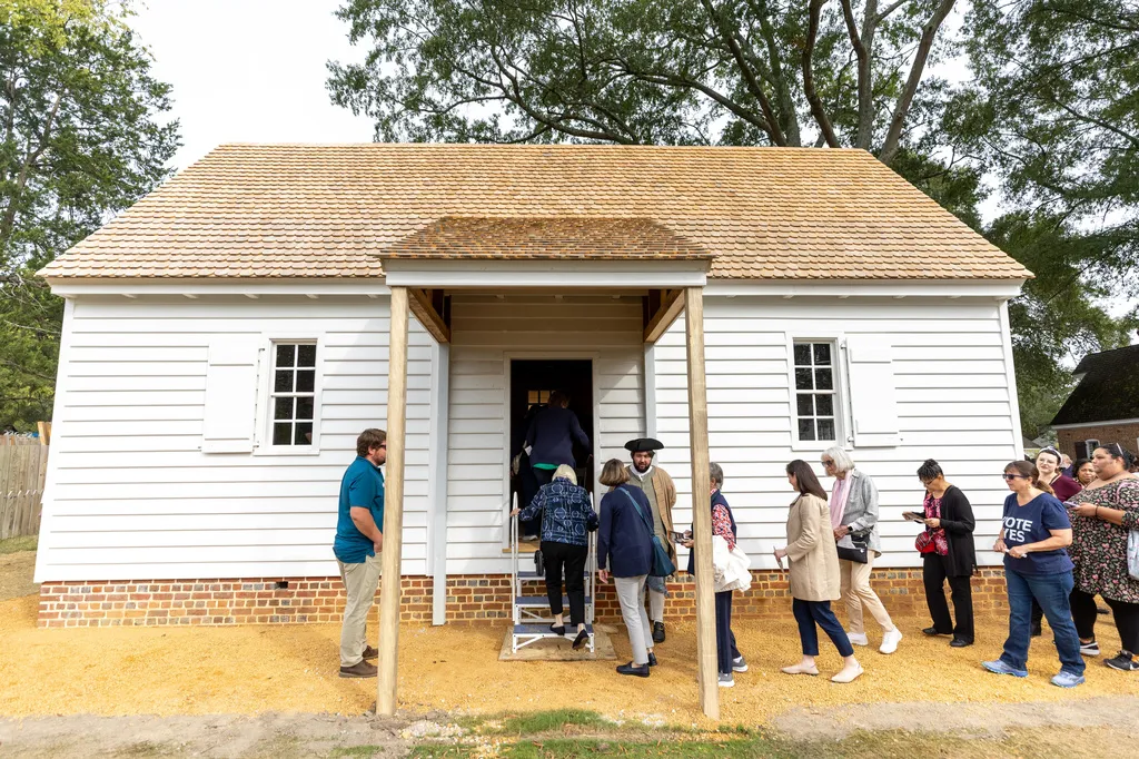 People line up to enter the reconstructed African Baptist Meeting House, now known as First Baptist Church of Williamsburg