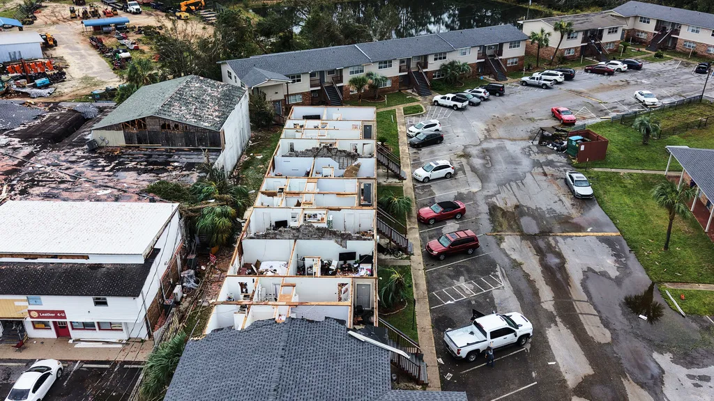 An apartment complex which had its roof ripped off is seen in the aftermath of Hurricane Isaias in Milton, Fla.
