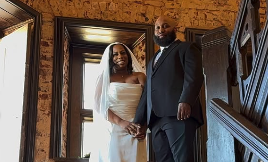 Bride and groom at top of staircase