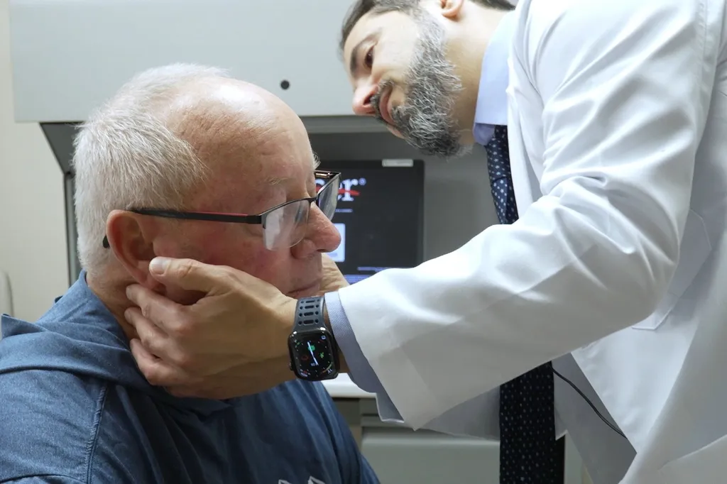 Tony Hout is examined by Dr. Hussein Tawbi at UT MD Anderson Cancer Center in Houston