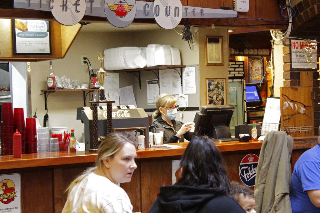 Restaurant co-owner Liz Mitchell works behind the counter at the Carver Hangar in Boring, Ore.