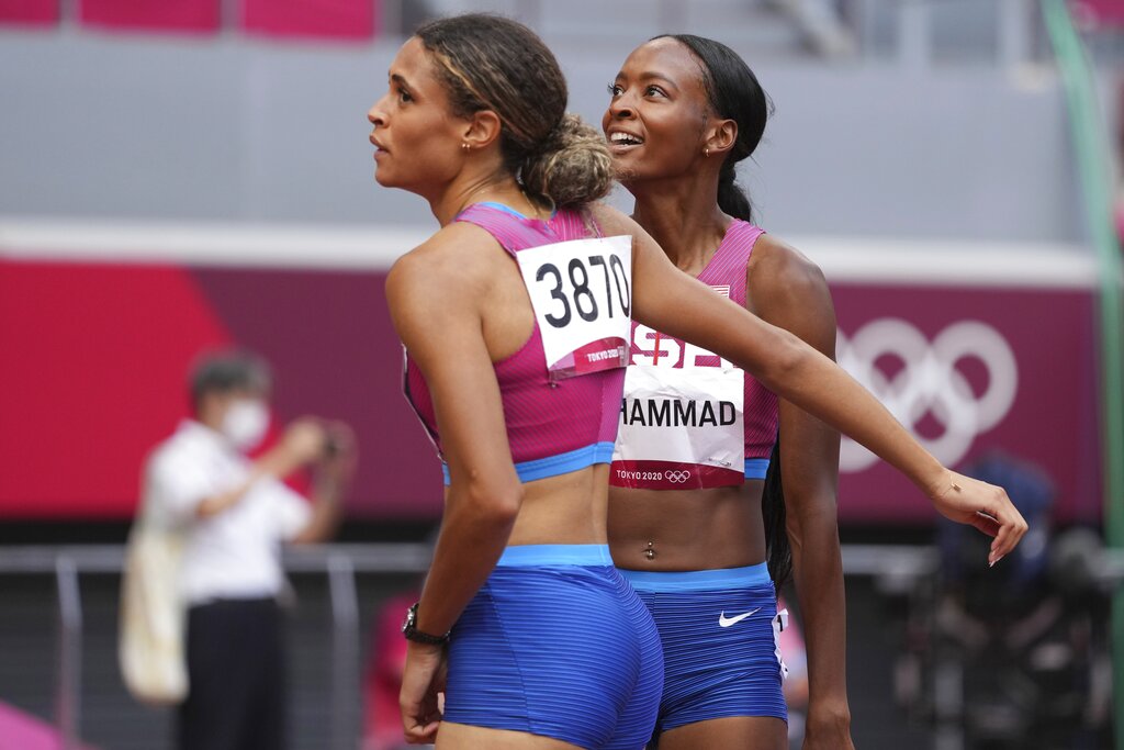 Sydney McLaughlin of the United States, left, celebrates with teammate Dalilah Muhammad after winning the final of the women
