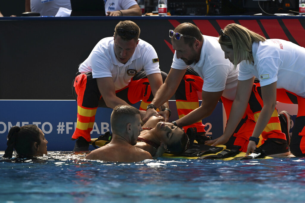 Anita Alvarez of United States is taken from the pool after collapsing during the solo free final of the artistic swimming at the 19th FINA World Championships