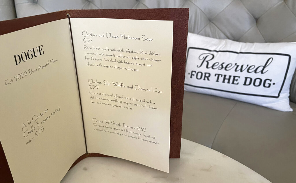 A menu for a multi-course menu is displayed at the Dogue restaurant