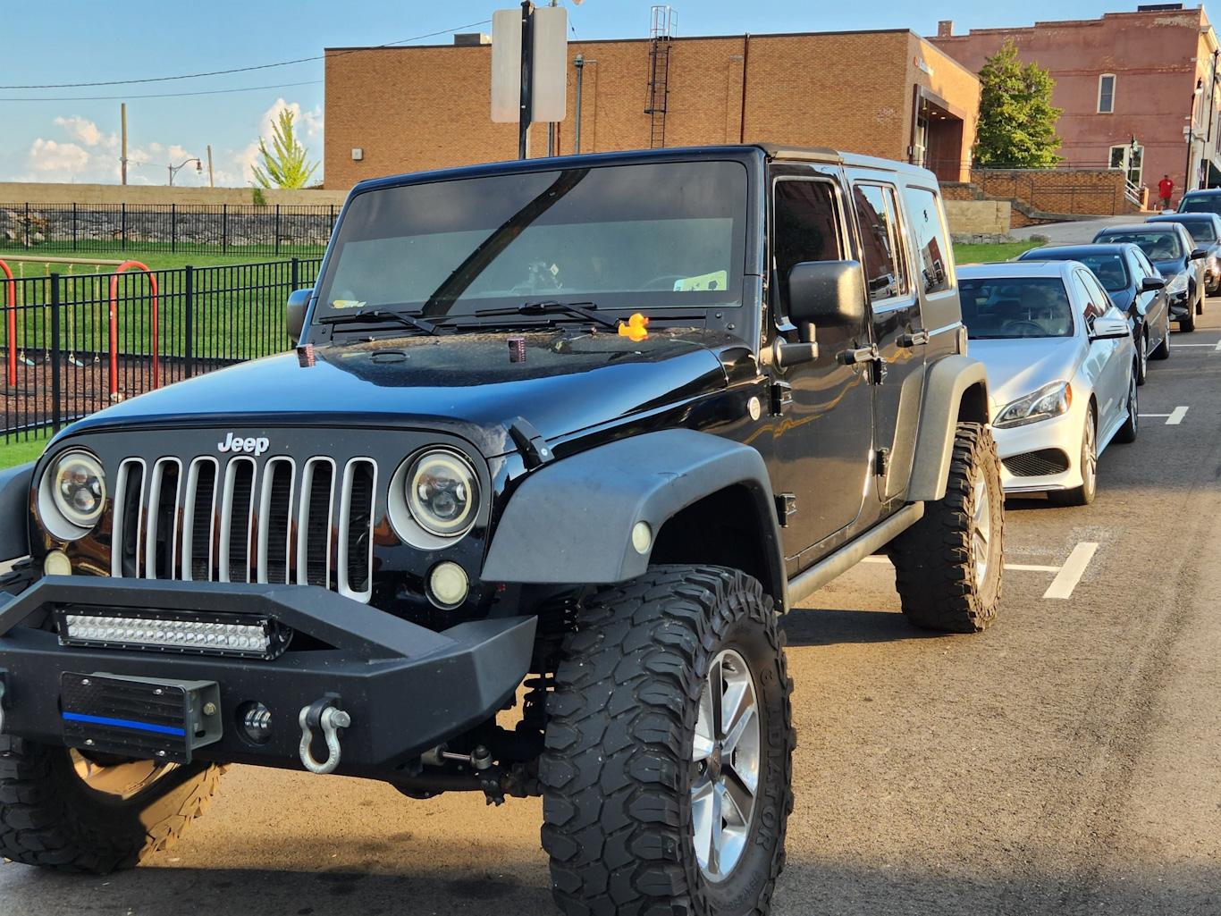 Duck planted on a jeep by church member