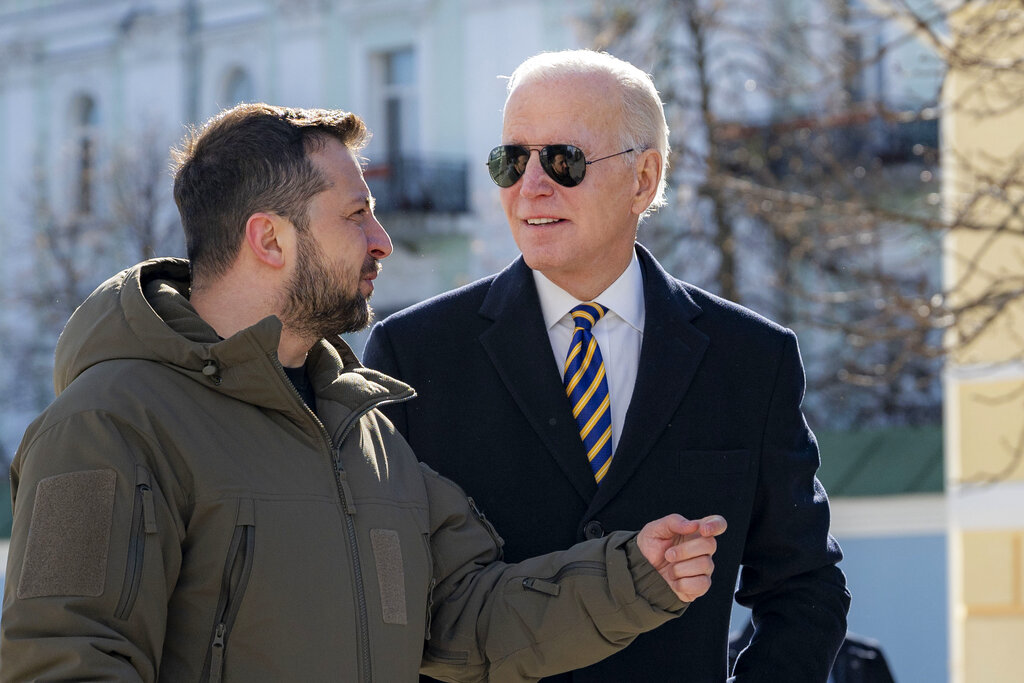 President Biden and Ukrainian President Zelenskyy talk during an unannounced visit