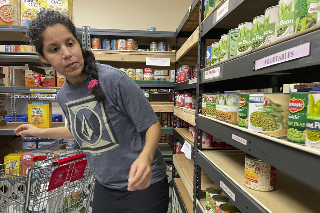 Stephanie Duboc of Eagle River, Alaska, shops at the Chugiak-Eagle River Food Pantry inside a Presbyterian church in Eagle River, Alaska on Friday, April 21, 2023.