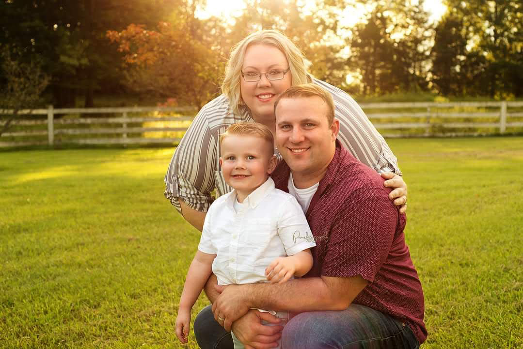 Tracee Campbell (back) with her husband Earnest (right) and son (left)