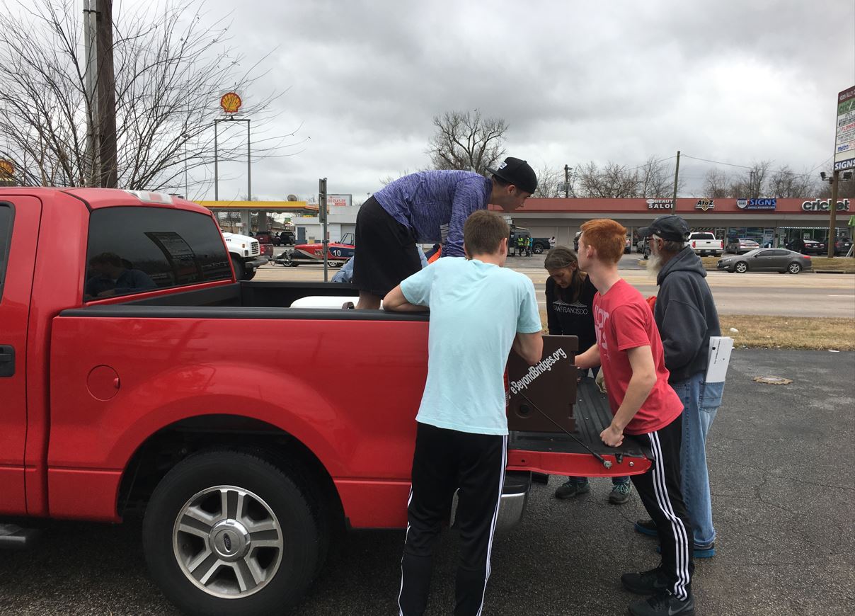 Hope Beyond Bridges volunteers delivering food, supplies