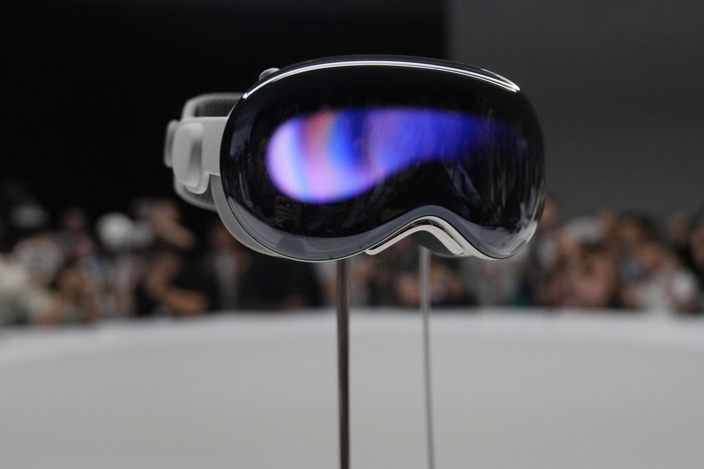 The Apple Vision Pro headset is displayed in a showroom on the Apple campus in Cupertino, Calif.