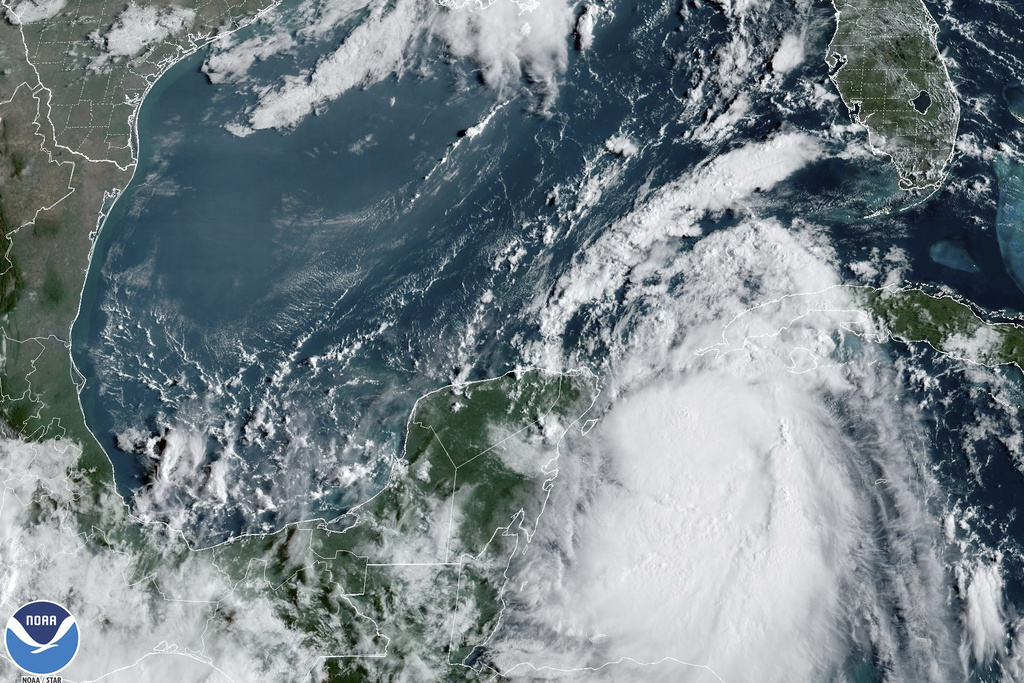 In this Monday, Aug. 28, 2023, 9:41 am ET satellite image provided by the National Oceanic and Atmospheric Administration, Tropical Storm Idalia moves between Mexico