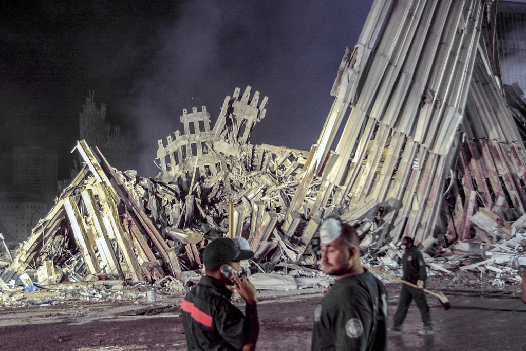 First responders work at ground zero after the Sept.11 attacks, Sept. 12, 2001, in New York