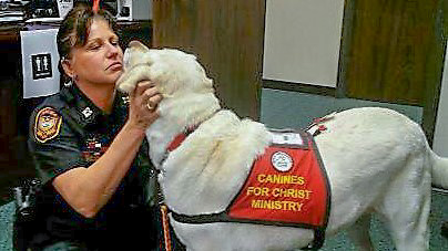 Gracie with a police officer. Canines 4 Christ knows how much officers go through.