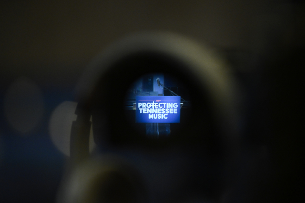 A video camera sits ready with its lens on the podium message before Tennessee Governor Bill Lee unveiled new legislation designed to protect songwriters, performers and other music industry professionals