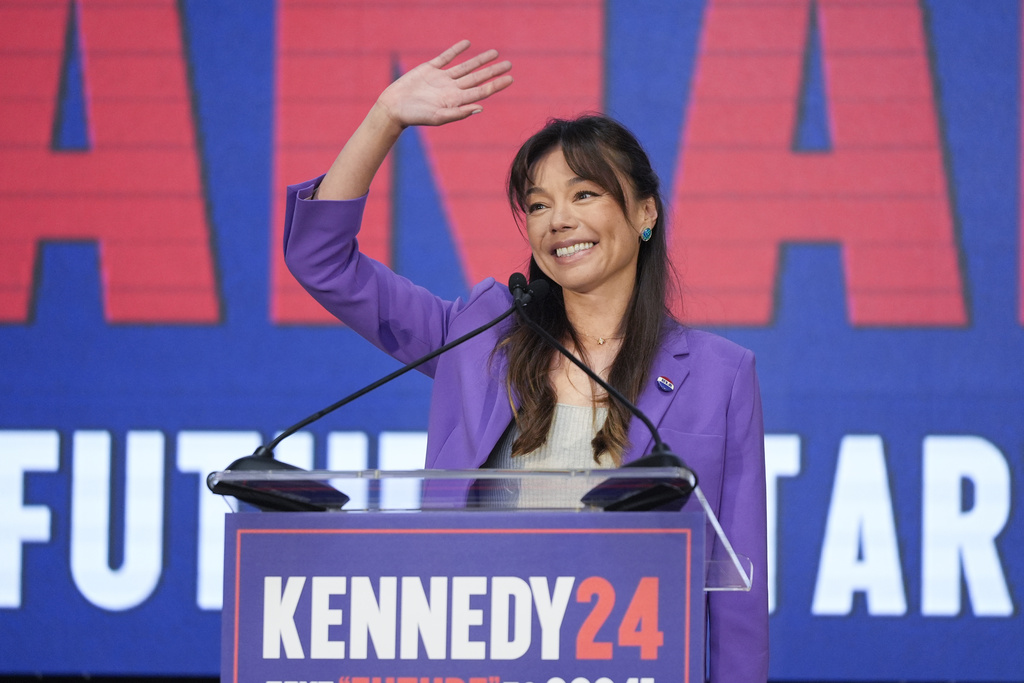 Nicole Shanahan waves from the podium during a campaign event for Presidential candidate Robert F. Kennedy Jr.