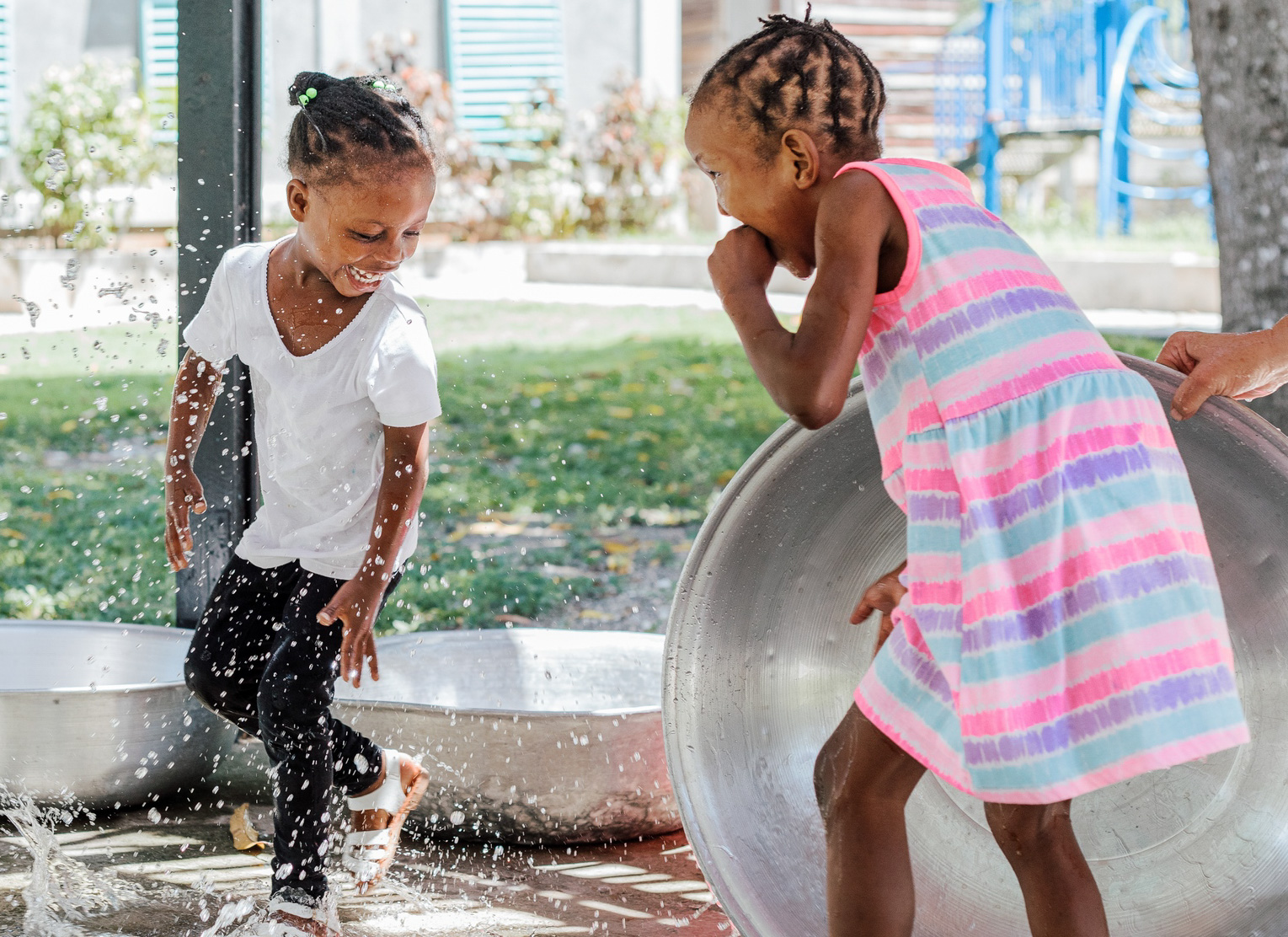 Two little girls playing in the water