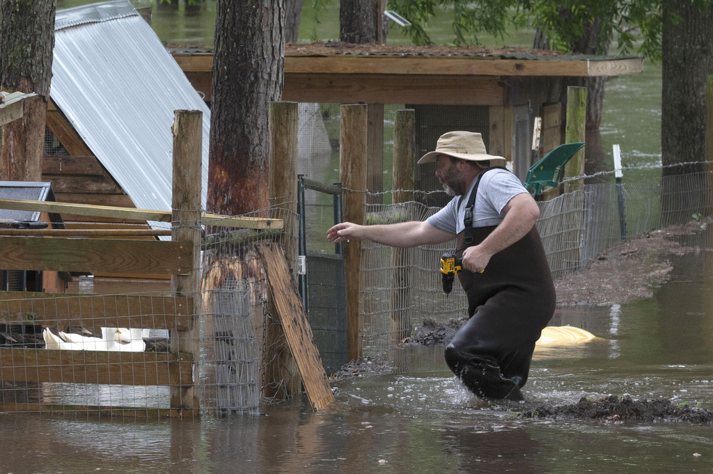 Overflow from the swollen Trinity River fills James Smart