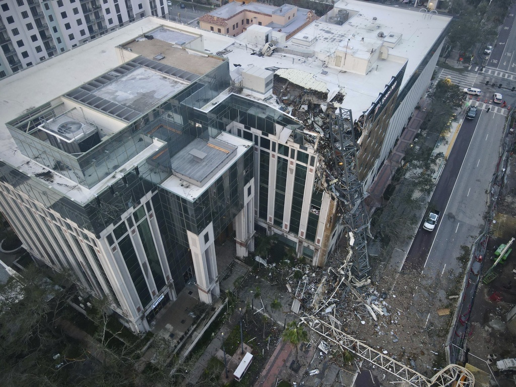 A construction crane fell over into an office building that houses the Tampa Bay Times